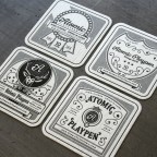 _0005_atomic_playpen_coasters_front _0005_atomic_playpen_coasters_front